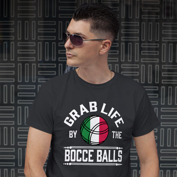A man wearing a black short-sleeved t-shirt with the saying grab live by the bocce balls and a graphic of a bocce ball