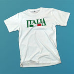Italia adult white t-shirt on a table