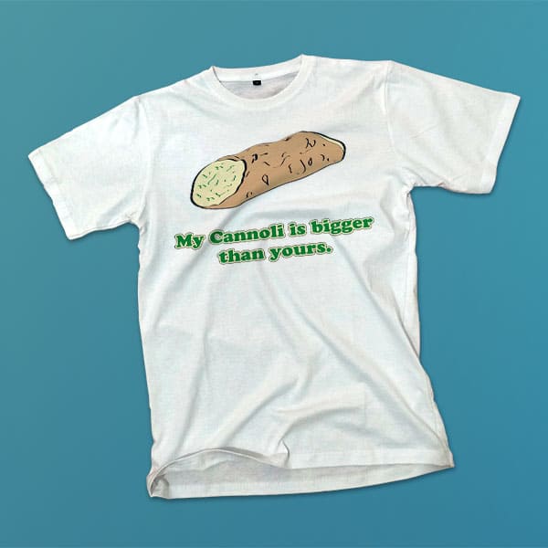 My Cannoli is bigger than yours adult white t-shirt on a table