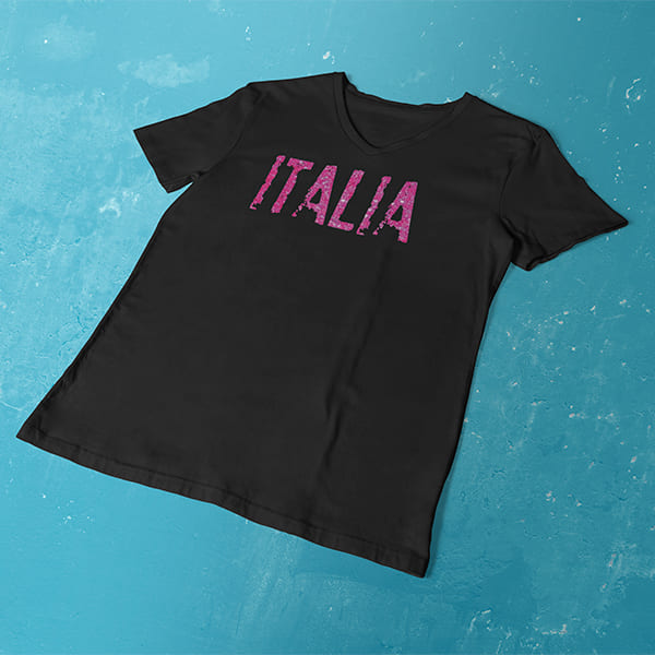 Distressed Italia pink glitter ladies v-neck black t-shirt on a table
