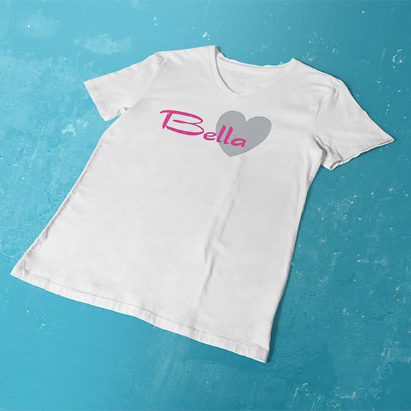 Pink Bella Heart ladies v-neck white t-shirt on a table
